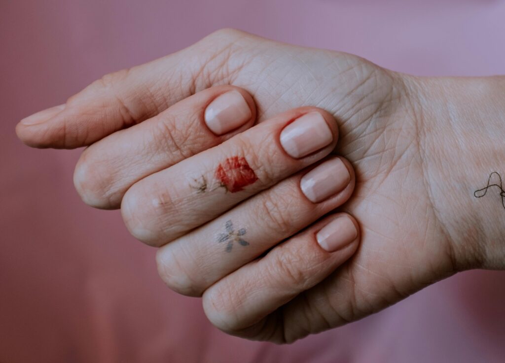 A fist displaying natural, shiny nails